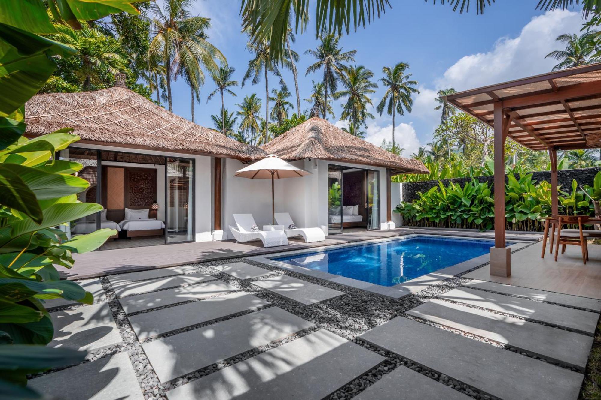 Nirwana Beach & Resort Candidasa Exteriör bild A villa at the resort
